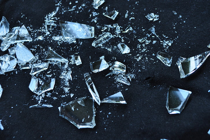 shards of broken glass against a dark background