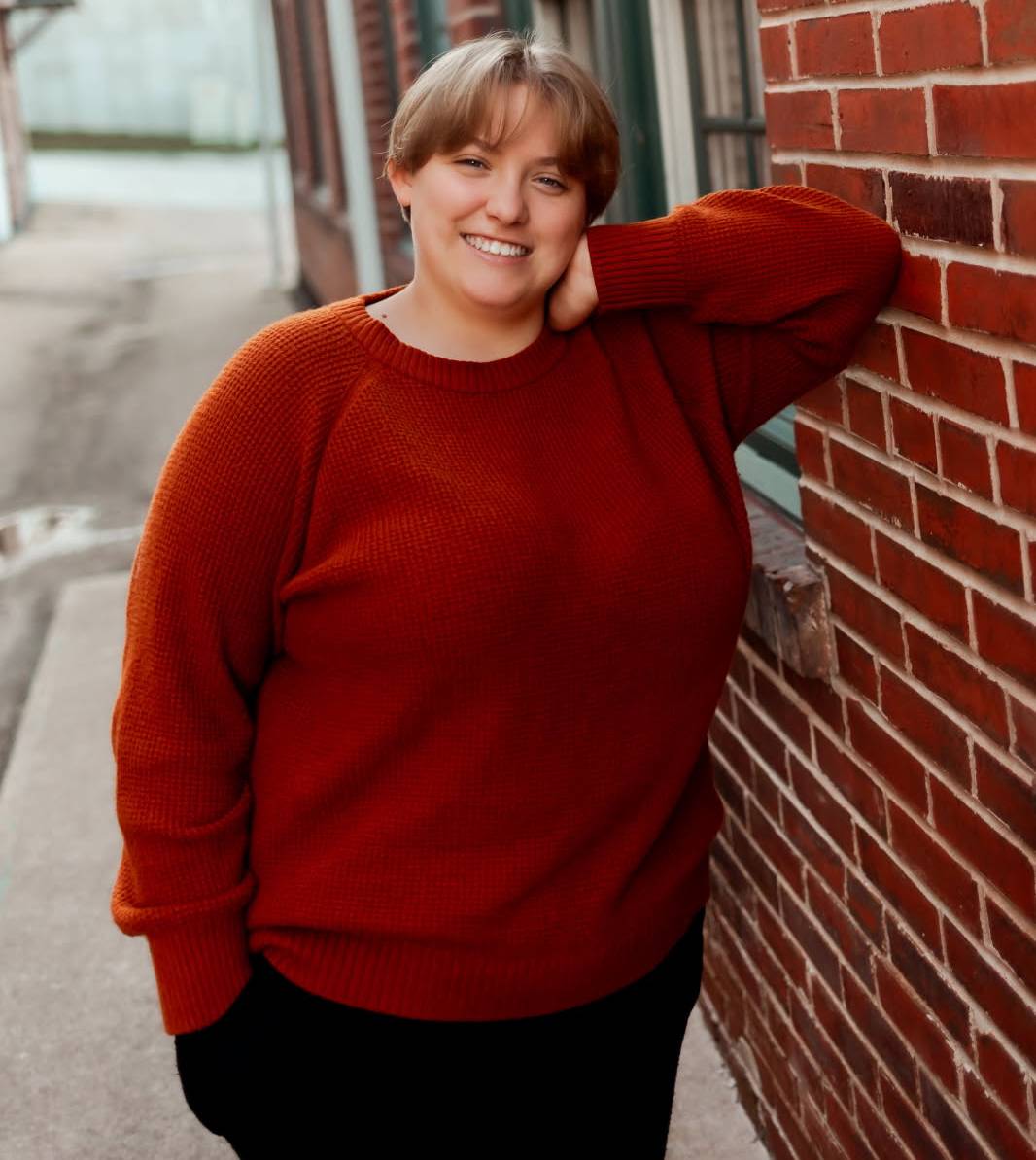 A picture of me leaning against a brick wall